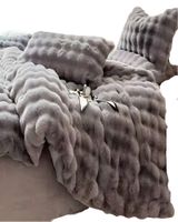 COBERTOR IMITACION DE PIEL DE CONEJO CON CHIPORRO GRIS