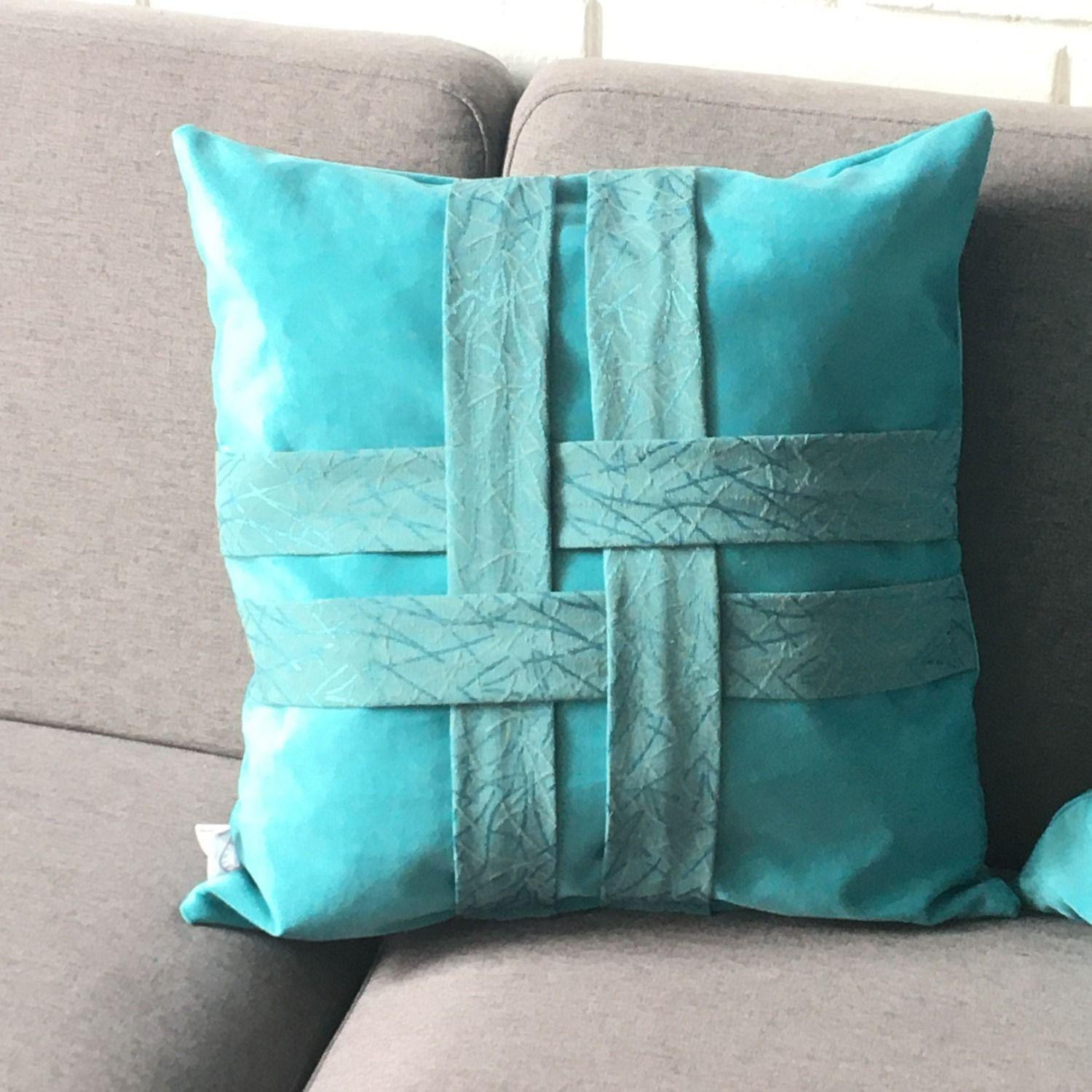 COJIN DECORATIVO DISEÑO CINTAS TURQUESA 60X60 RELLENO-1