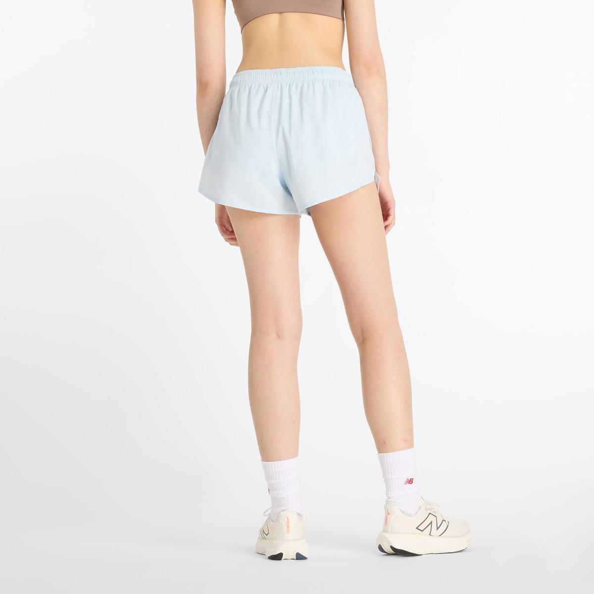 Short Mujer New Balance Sport Essentials Celeste-1