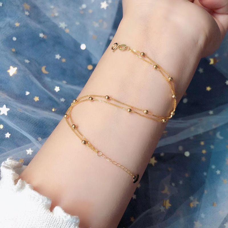 PULSERA DOBLE PELOTITAS ORO AMARILLO 18K-1