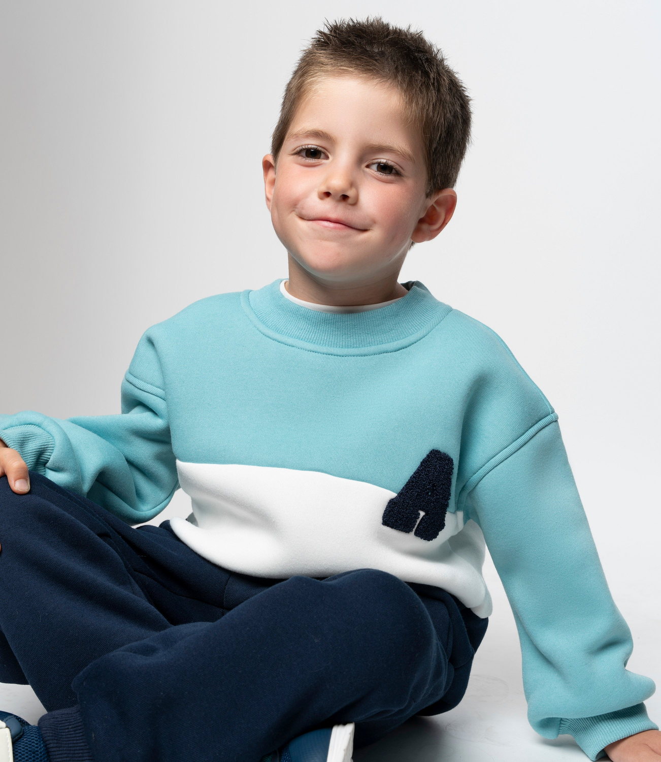 Buzo niño tricolor menta Black and Blue-0