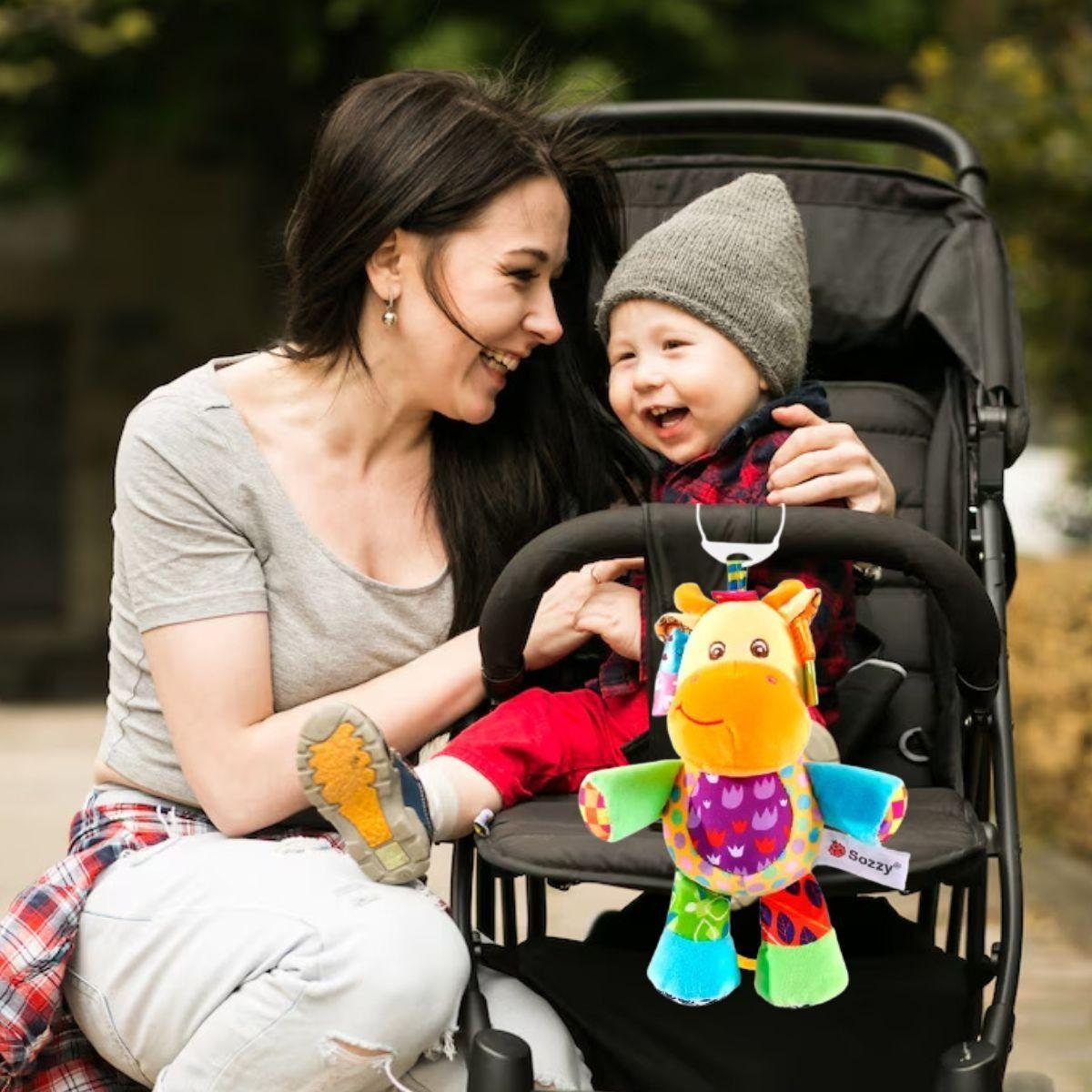 SONAJERO PELUCHE COLGANTE MUSICAL SENSORIAL BEBE LAU-8