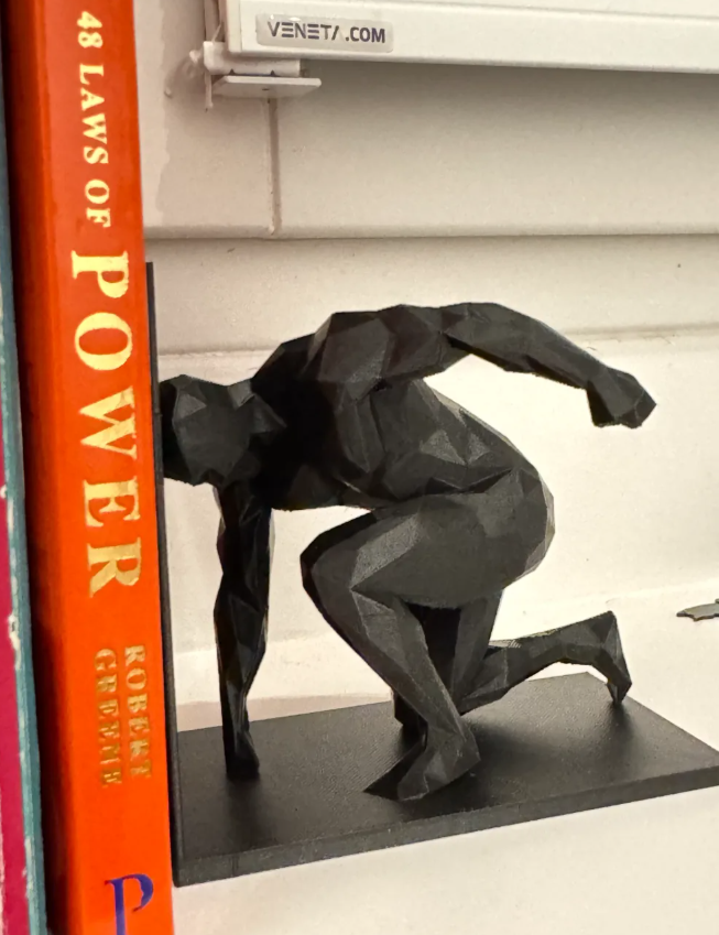 Sujeta libros - Hombre polígono-2