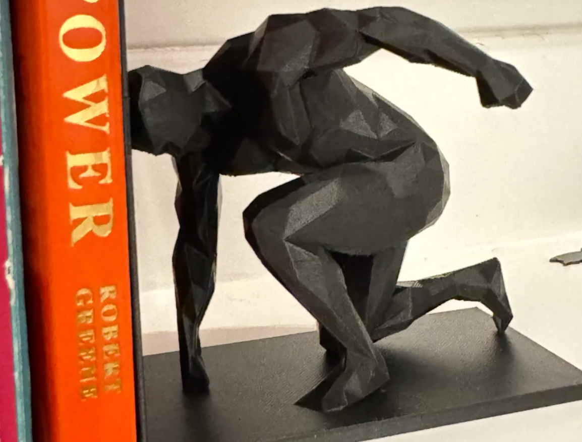 Sujeta libros - Hombre polígono-3