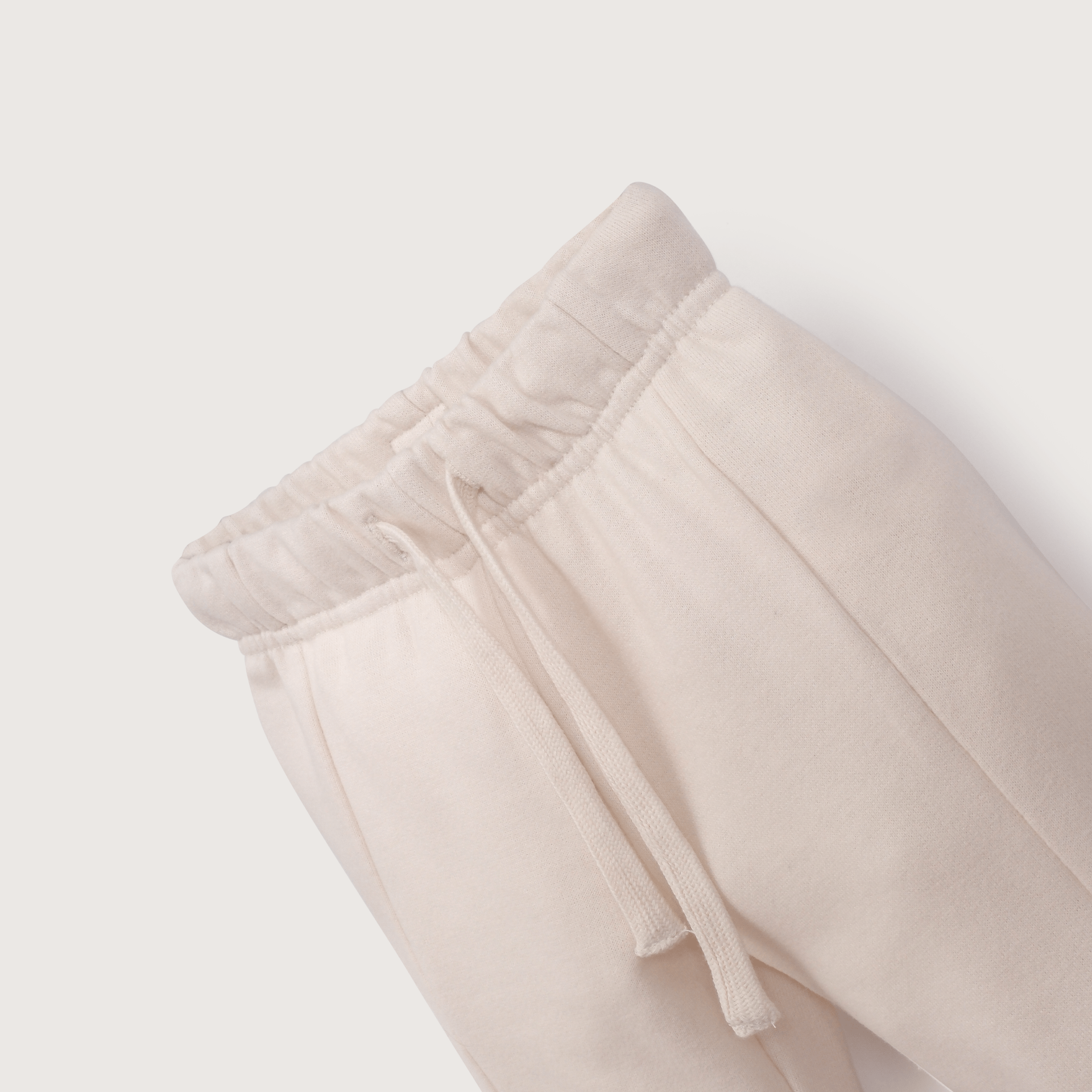 Pantalón de buzo crema de niña-3