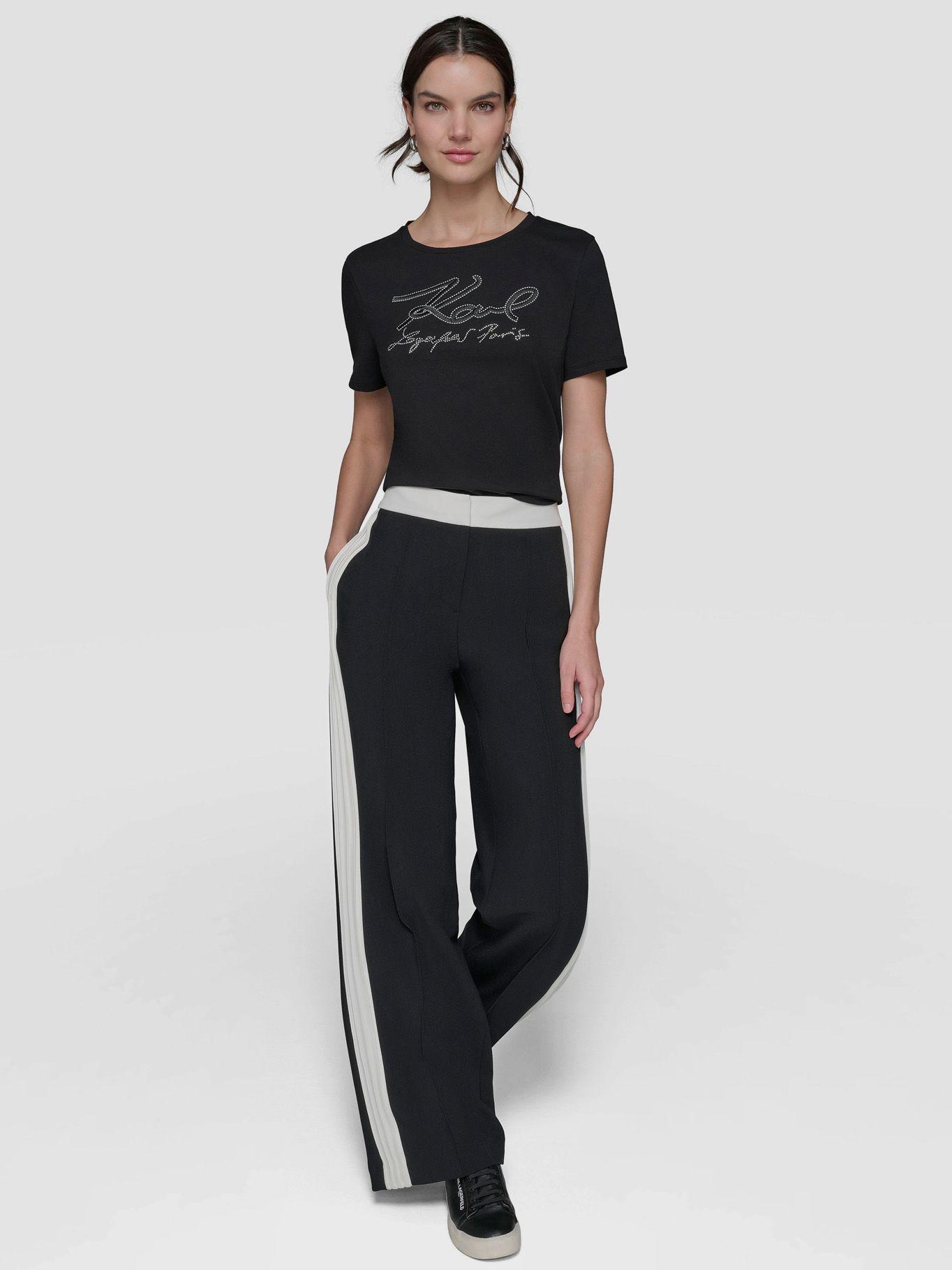 Pantalón con pliegues en contraste Negro-1