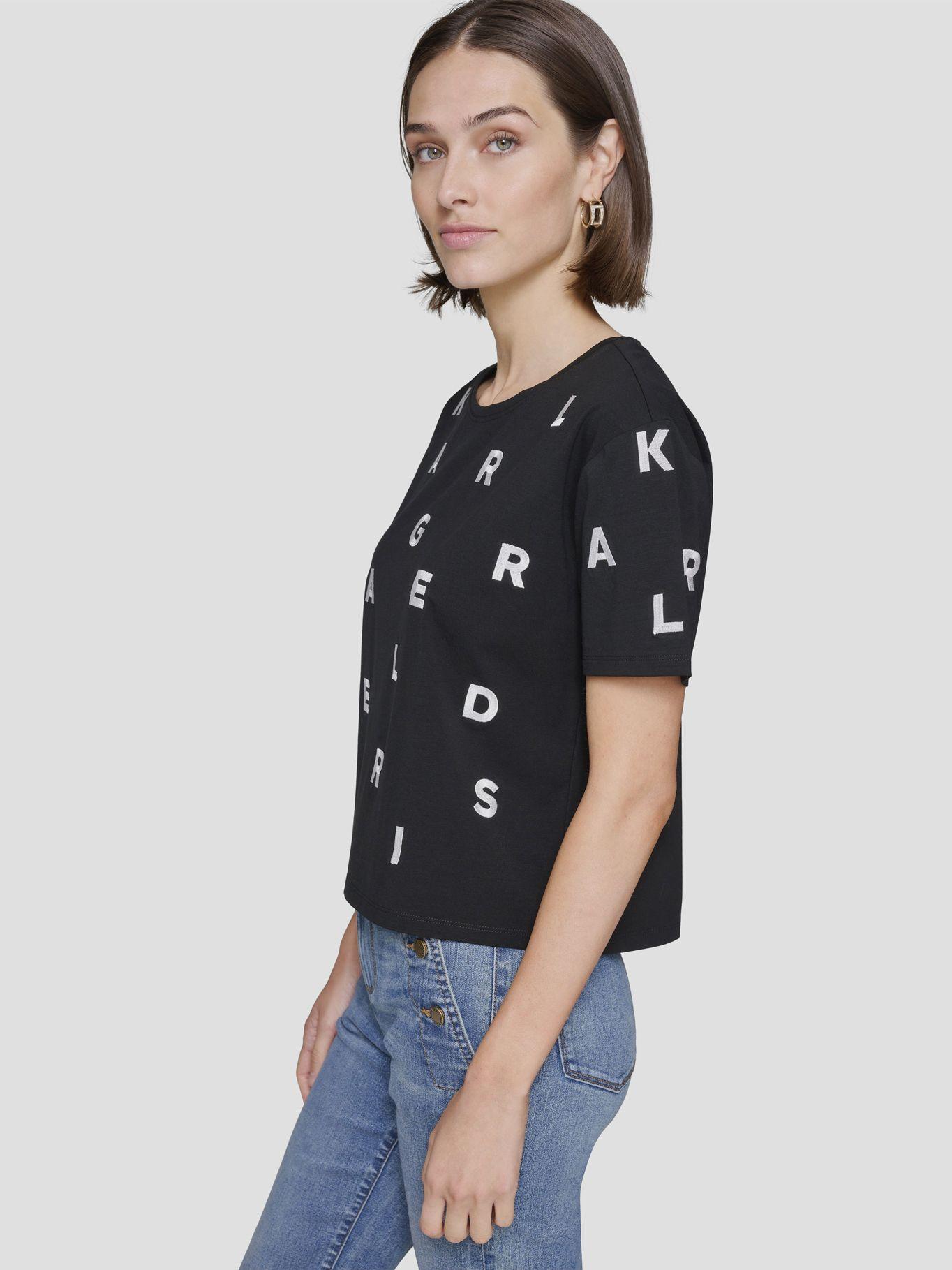 Polera con letras dispersas tejidas Negra-2