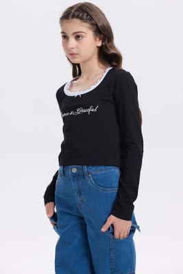 Imagen 2 del producto Polera Niña Con Aplicación Negro