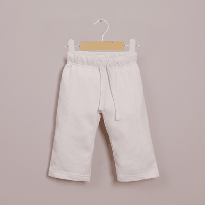 Pantalón de buzo crema de niña