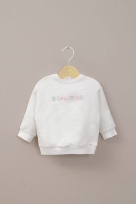 Polerón blanco de bebé niña