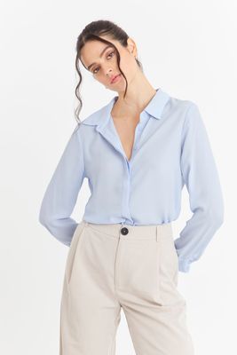 Blusa Básica Botonera Invisible Celeste Nicopoly