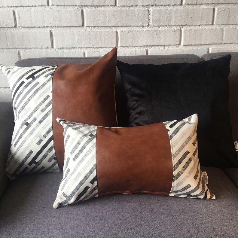 COJIN DECORATIVO ECOCUERO GRIS Y BEIGE 50X30 RELLENO-1