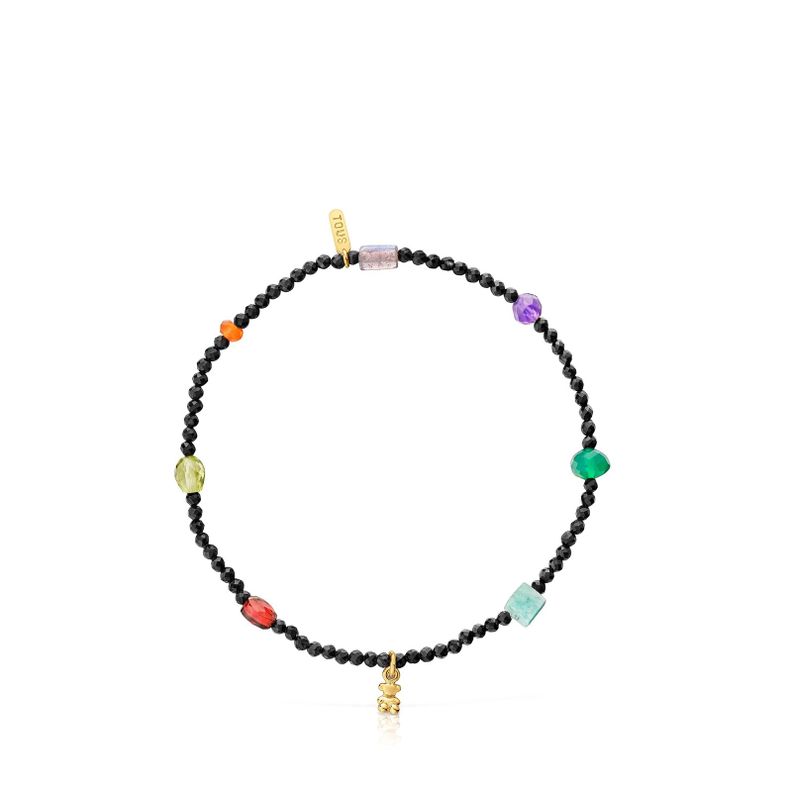 Pulsera elástica con baño de oro 18 kt sobre plata y onix-1